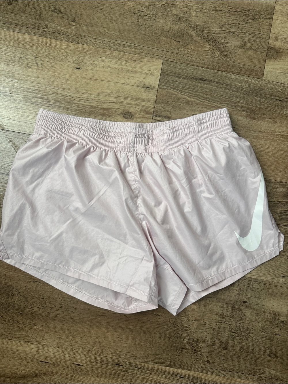 Nike Women's Pale Pink Running Shorts with White Swoosh